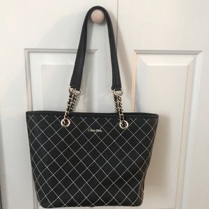 Calvin Klein bag with gold hardwares.